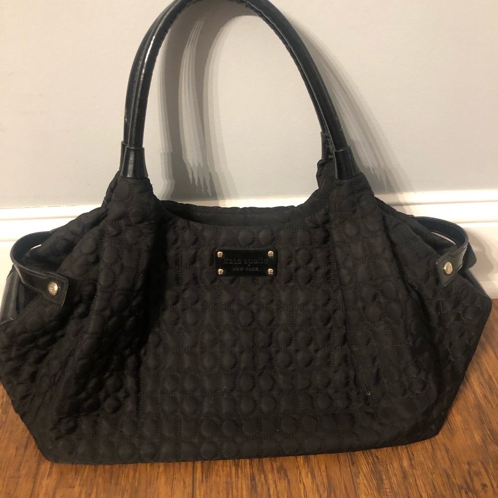 Kate Spade Black puffed handbag* over the shoulder straps*